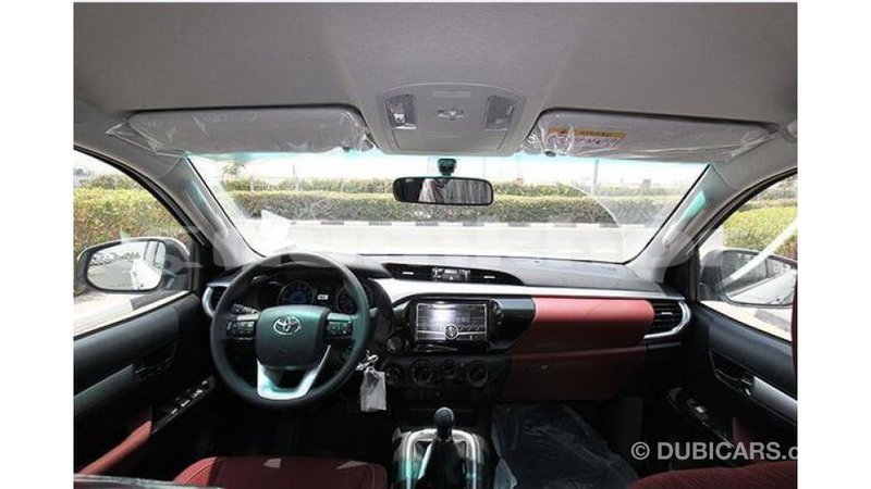 Big with watermark toyota hilux bumthang import dubai 2124