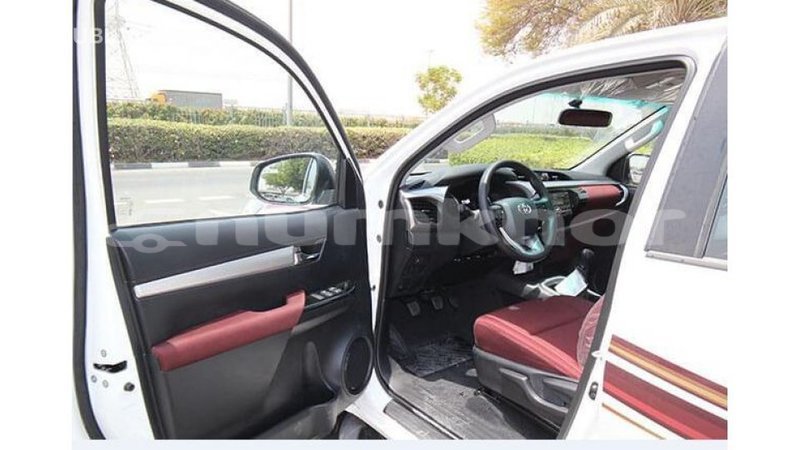 Big with watermark toyota hilux bumthang import dubai 2124