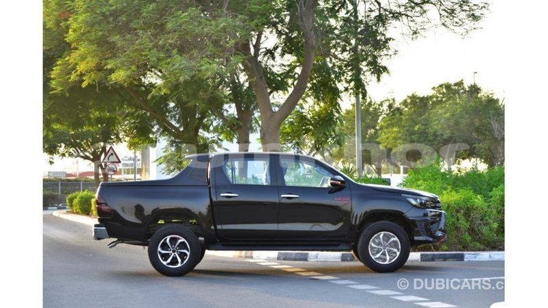 Big with watermark toyota hilux bumthang import dubai 2165