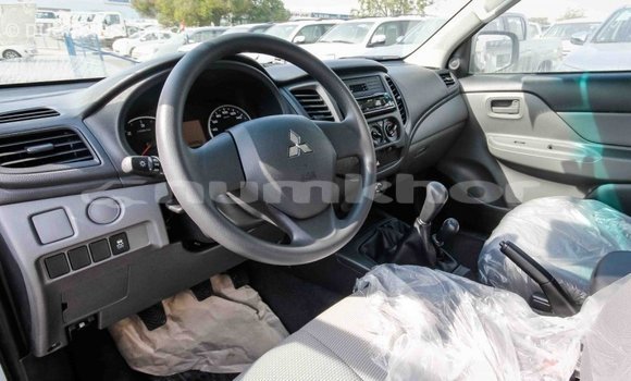 Buy Import Mitsubishi L200 White Car in Import - Dubai in Bumthang